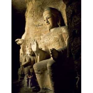 Visitor Beside One of Buddha Statues at 5th Century Yungang Caves, a 