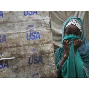  A Somali Child Covers Her Face at Dadaab Refugee Camp in 