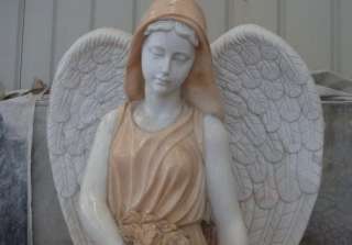   statue of a weeping angel sitting on a bench in the past many of our