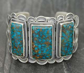 Turquoise stones in a sterling silver setting. Beautifully accenting 
