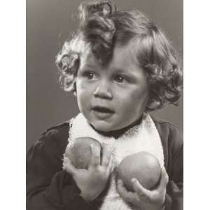  Little Girl Holding Two Oranges in Her Hands Photographic 