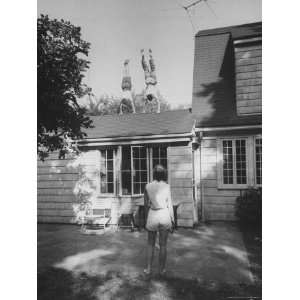  Teenagers Performing Handstands on Their Roof Stretched 