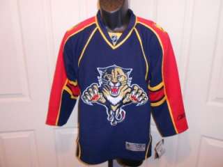 This is a Reebok Florida PANTHERS SEWN jersey. Tags attached show MSRP 