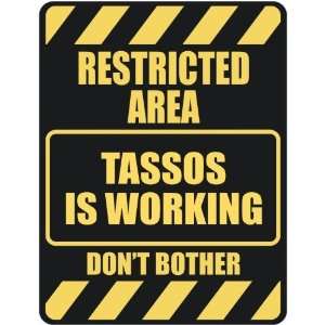   RESTRICTED AREA TASSOS IS WORKING  PARKING SIGN