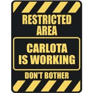   RESTRICTED AREA CARLOTA IS WORKING  PARKING SIGN