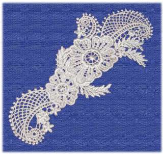 These white appliques are rayon machine embroidered. Has floral design 