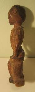 EARLY LOBI CARVING OF A SEATED COLONIAL MALE FIGURE  