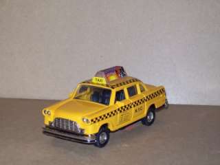 NYC Checkered Taxi Cab Diecast Metal Car Rolling Action  