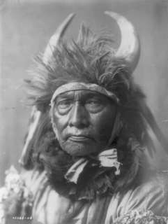 1908 Bull Chief Apsaroke wearing headdress with horns  