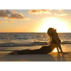  Forty Year Old Woman Doing Yoga at Sunrise on the Beach 