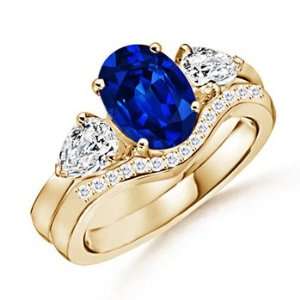  Oval Sapphire and Diamond Three Stone Ring in Yellow Gold 