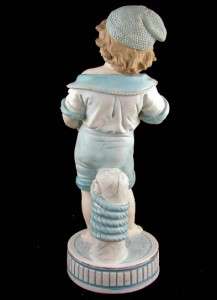   PORCELAIN BISQUE FIGURINE CA.1880s SAILOR BOY WITH SEASHELL  