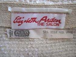 The coat retailed at the ELIZABETH ARDEN THE SALON, circa 1980s.