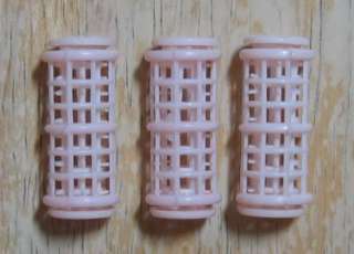 Up for bid is a lot of 3 pink hair rollers with sure set grippers for 