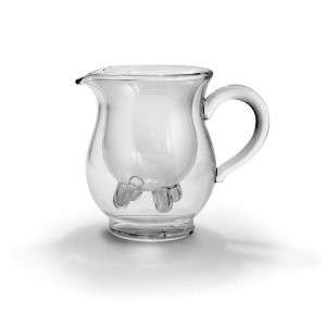   with help from this playful little pitcher perfect for serving milk