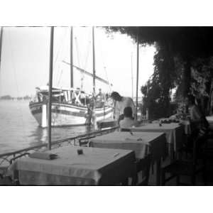  Tables at the Lido Cafe in Venice, with a Boat Out on the 