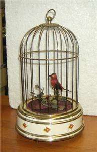 Vintage mechanical singing bird in cage with perch West Germany 